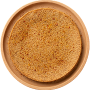 Round masala khakhra, a thin Indian spiced flatbread, on a brown plate.
