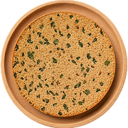 Round crispy Indian snack Methi Khakhra with fenugreek leaves on a round wooden plate.